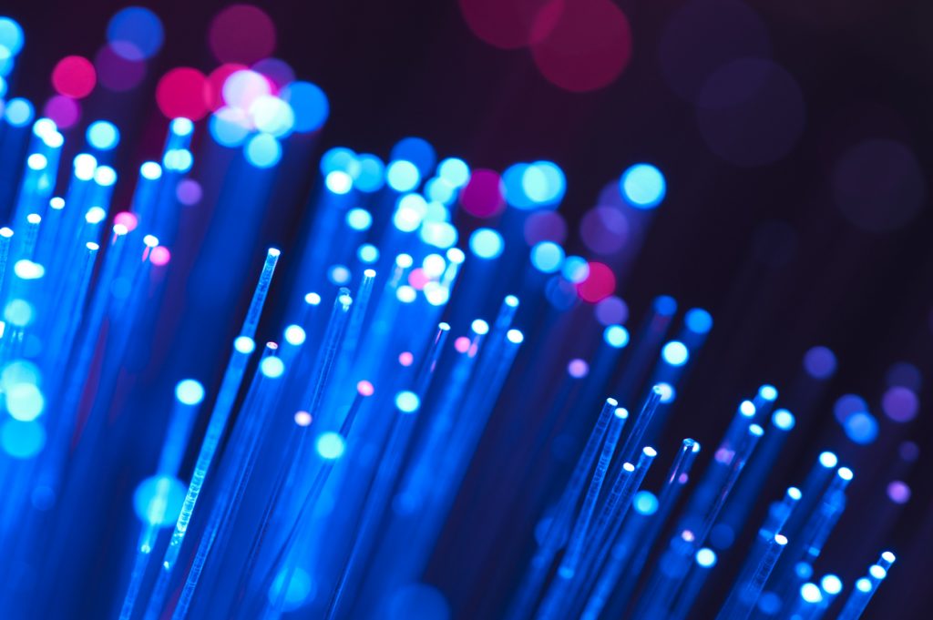 Blue and red fibre optical cables on a black background