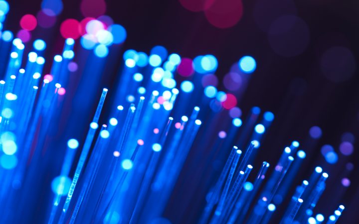Blue and red fibre optical cables on a black background