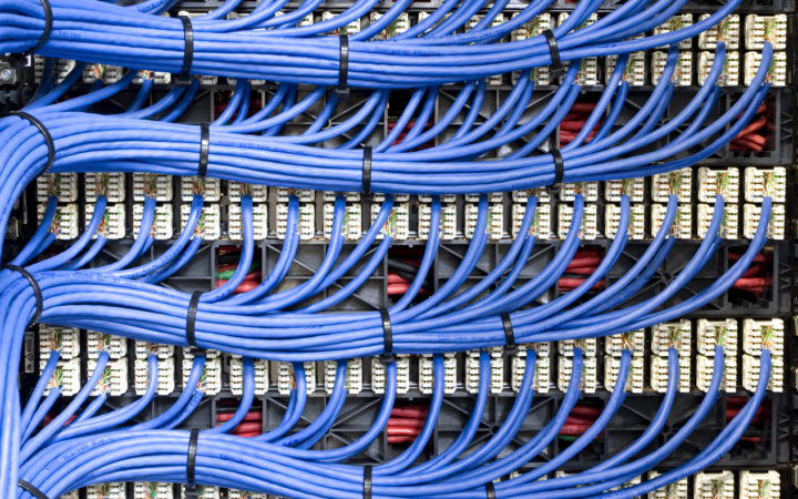 Blue Network Cables Blue network cables neatly channelled into their specified ports.