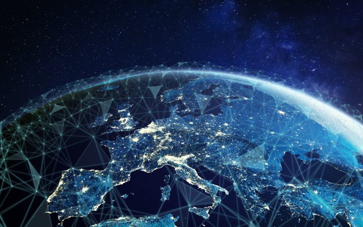 Telecommunication network above Europe viewed from space with connected system for European 5g LTE mobile web, global WiFi connection, Internet of Things (IoT) technology or blockchain fintech. Some elements from NASA (https://eoimages.gsfc.nasa.gov/images/imagerecords/57000/57752/land_shallow_topo_2048.jpg)