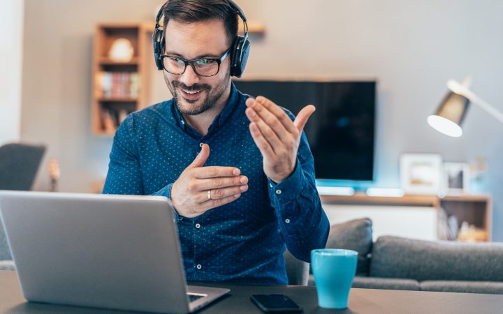 Business Video Conference Handsome businessman having Video Conference at home