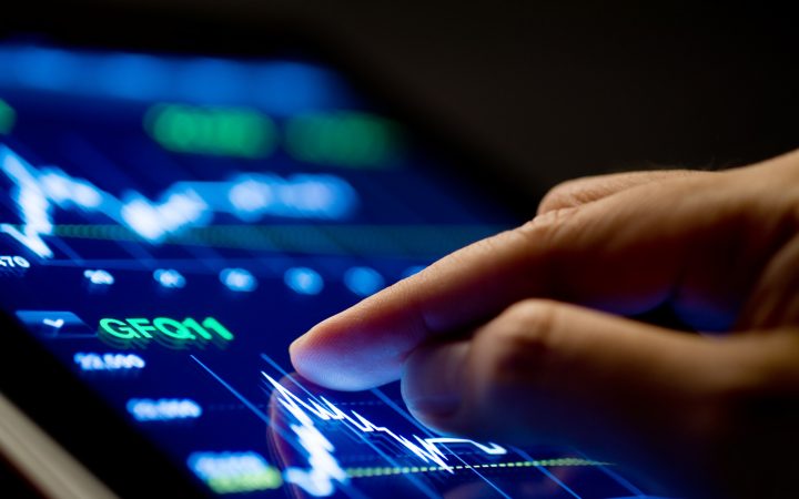 Market Analyze Market Analyze with Digital Moniter focus on tip of finger.