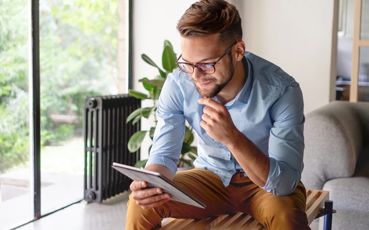 Young Man looking at digital tablet