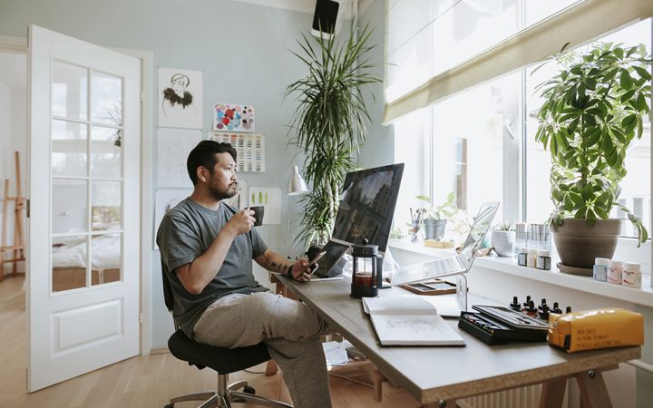 Photo series of Japanese digital artist at his home studio taking a coffee break.