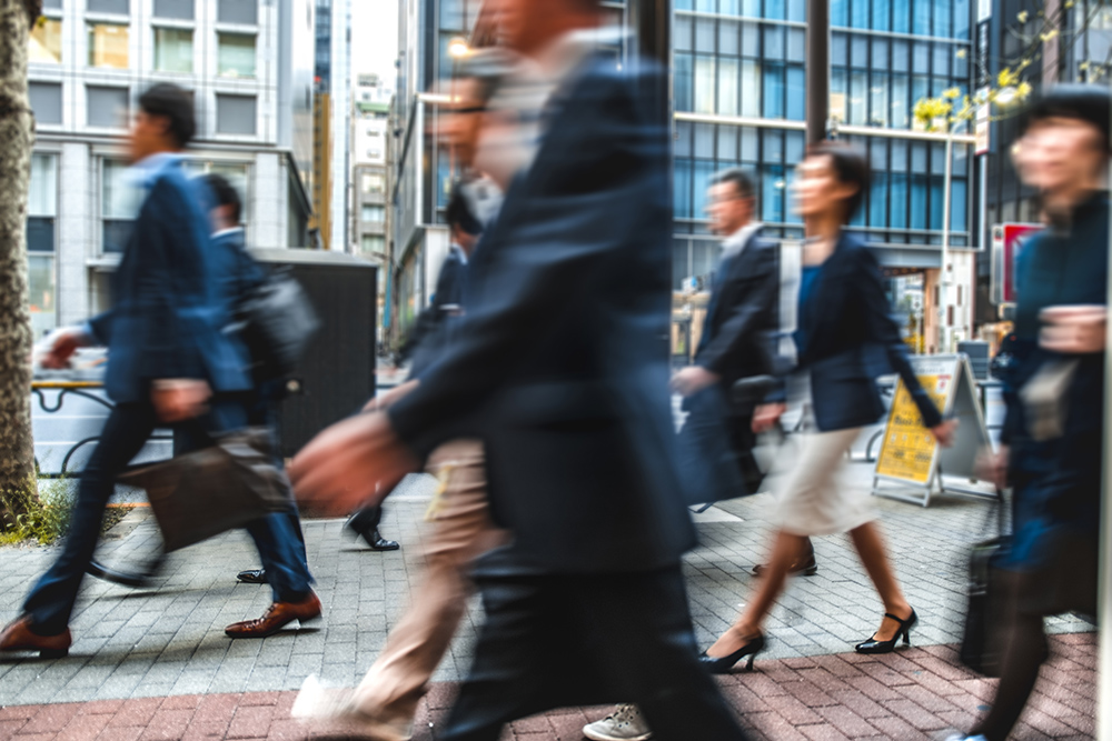 Blurred group of business people commuting on the streets of Japan