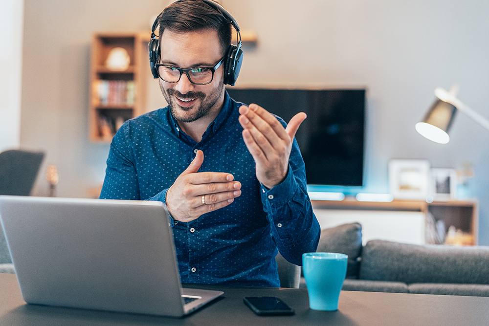 Business Video Conference Handsome businessman having Video Conference at home