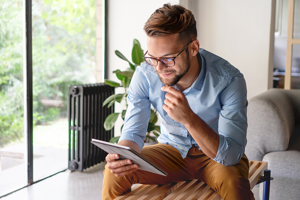 Young Man looking at digital tablet Young Man looking at digital tablet