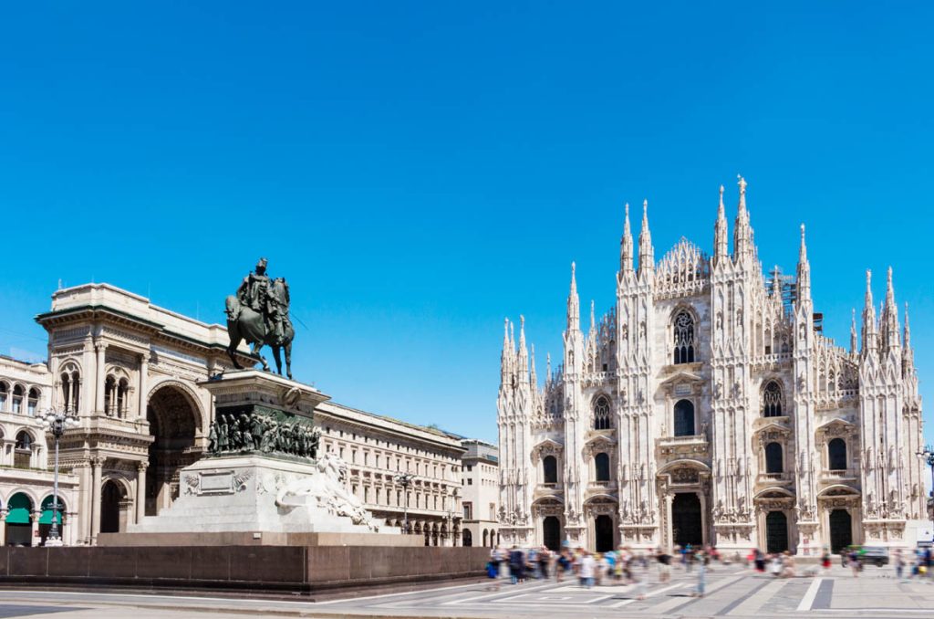Duomo square with statue of Victor Emanuel 2nd. Milan, Italy. from the wide angle view. The entrance of gallery arcade of Victor Emanuel2nd, the statue of him riding on the horse.