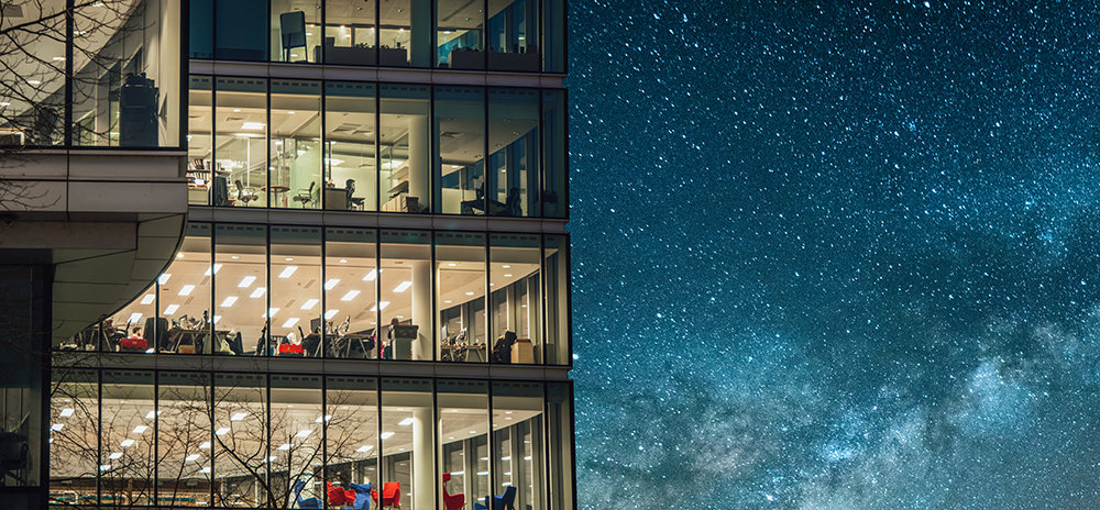 Office building at night under a beautiful starry sky