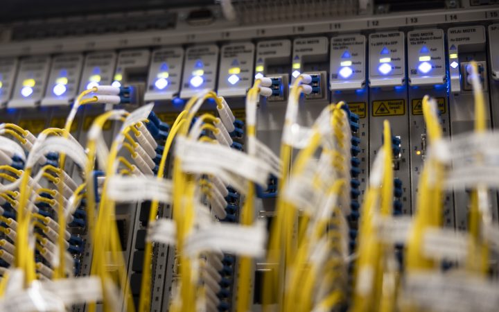 Photo of a junction box with many Ethernet cables plugged into it