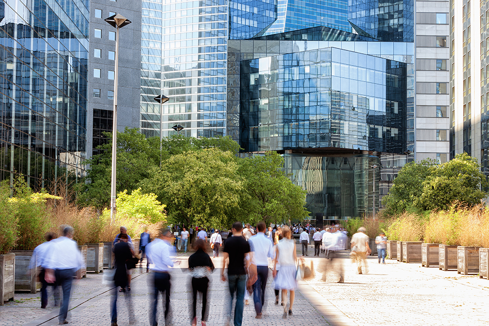 Business People in Financial District, La Defense, Paris, France crowd of business people walking through financial district towards modern office building, La Defense, Paris, France