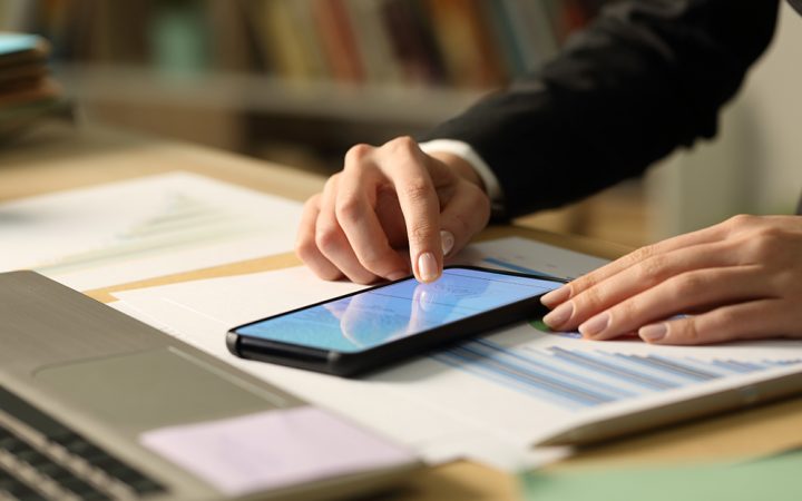 a hand scrolls on a smartphone