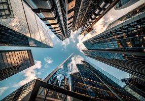 Highly detailed abstract wide angle view up towards the sky in the financial district of London City and its ultra modern contemporary buildings with unique architecture. Shot on Canon EOS R full frame with 10mm wide angle lens. Image is ideal for background.