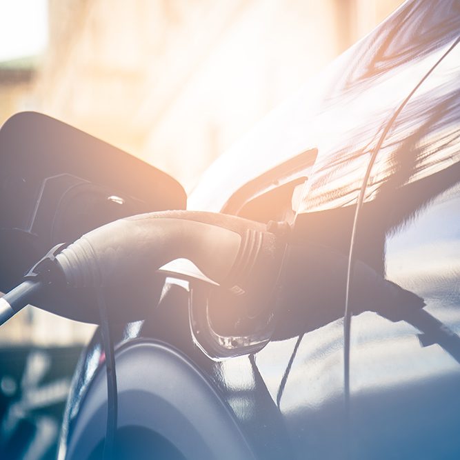 Recharging electric car by power cable.